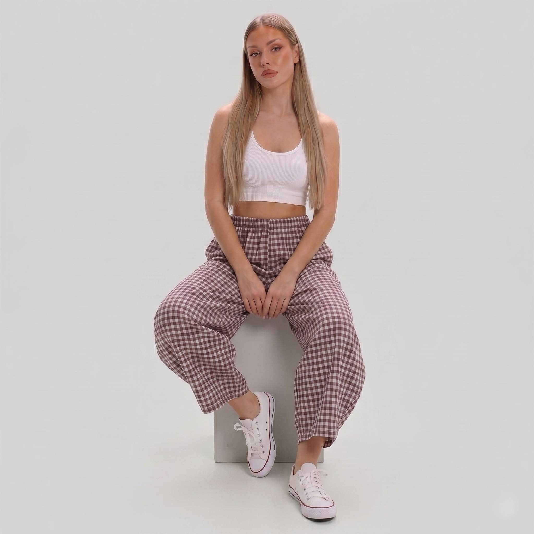 Women's Made in Italy gingham check barrel leg trousers featuring a relaxed fit, elastic waist, and cropped barrel leg silhouette, photographed on a fashion model in a professional studio.