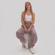 Women's Made in Italy gingham check barrel leg trousers featuring a relaxed fit, elastic waist, and cropped barrel leg silhouette, photographed on a fashion model in a professional studio.