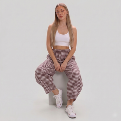 Women's Made in Italy gingham check barrel leg trousers featuring a relaxed fit, elastic waist, and cropped barrel leg silhouette, photographed on a fashion model in a professional studio.