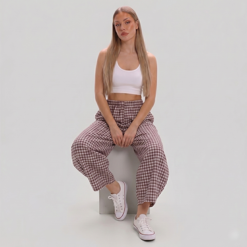 Women's Made in Italy gingham check barrel leg trousers featuring a relaxed fit, elastic waist, and cropped barrel leg silhouette, photographed on a fashion model in a professional studio.
